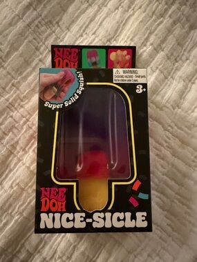 Nee doh Nice-Sicle Super Solid Squish Toy - pink purple and yellow